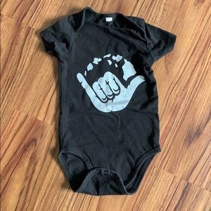Island Shaka baby black onesie